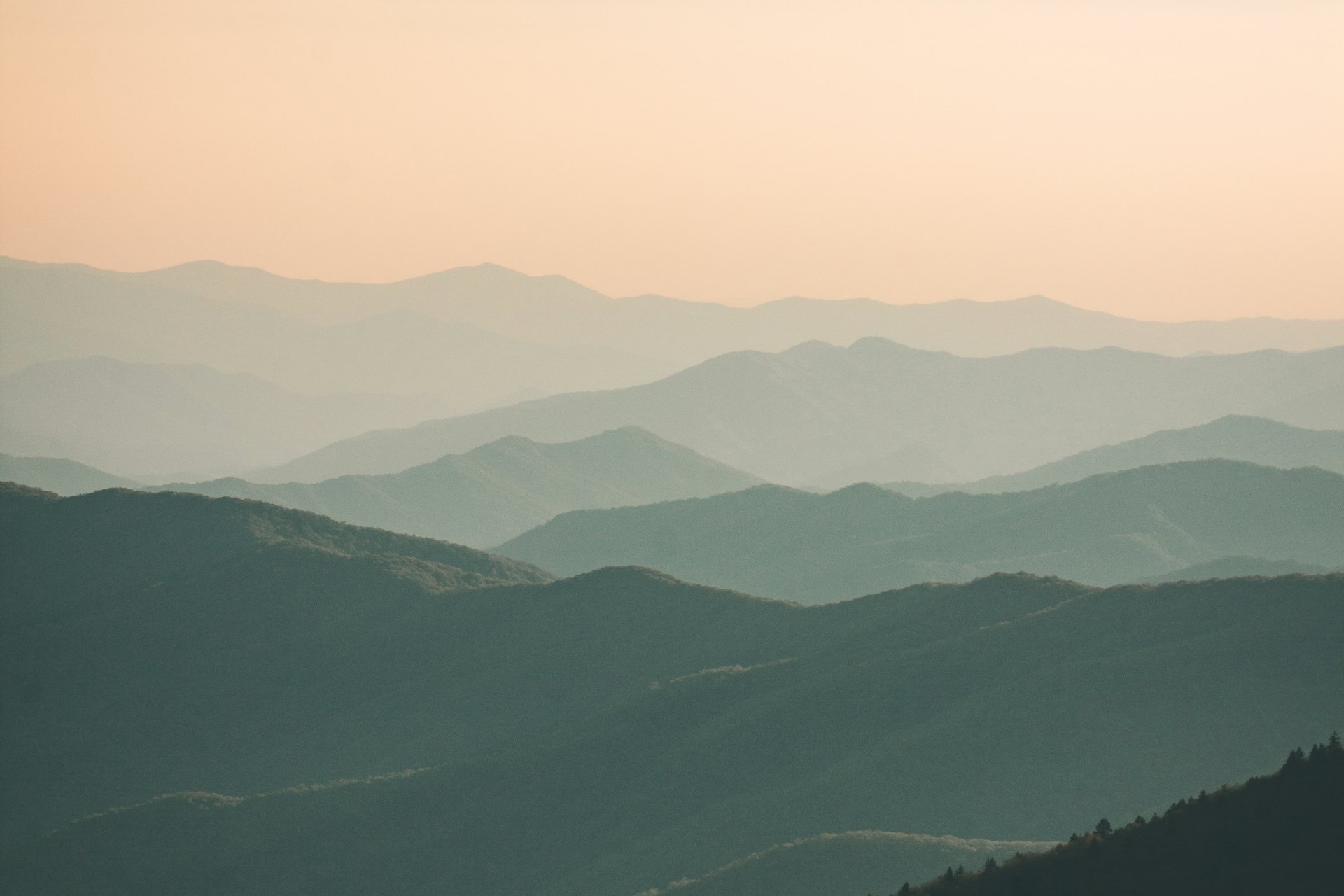 Layered Blue Ridge mountains fading into a soft dusk sky, near Great Smoky Mountains National Park