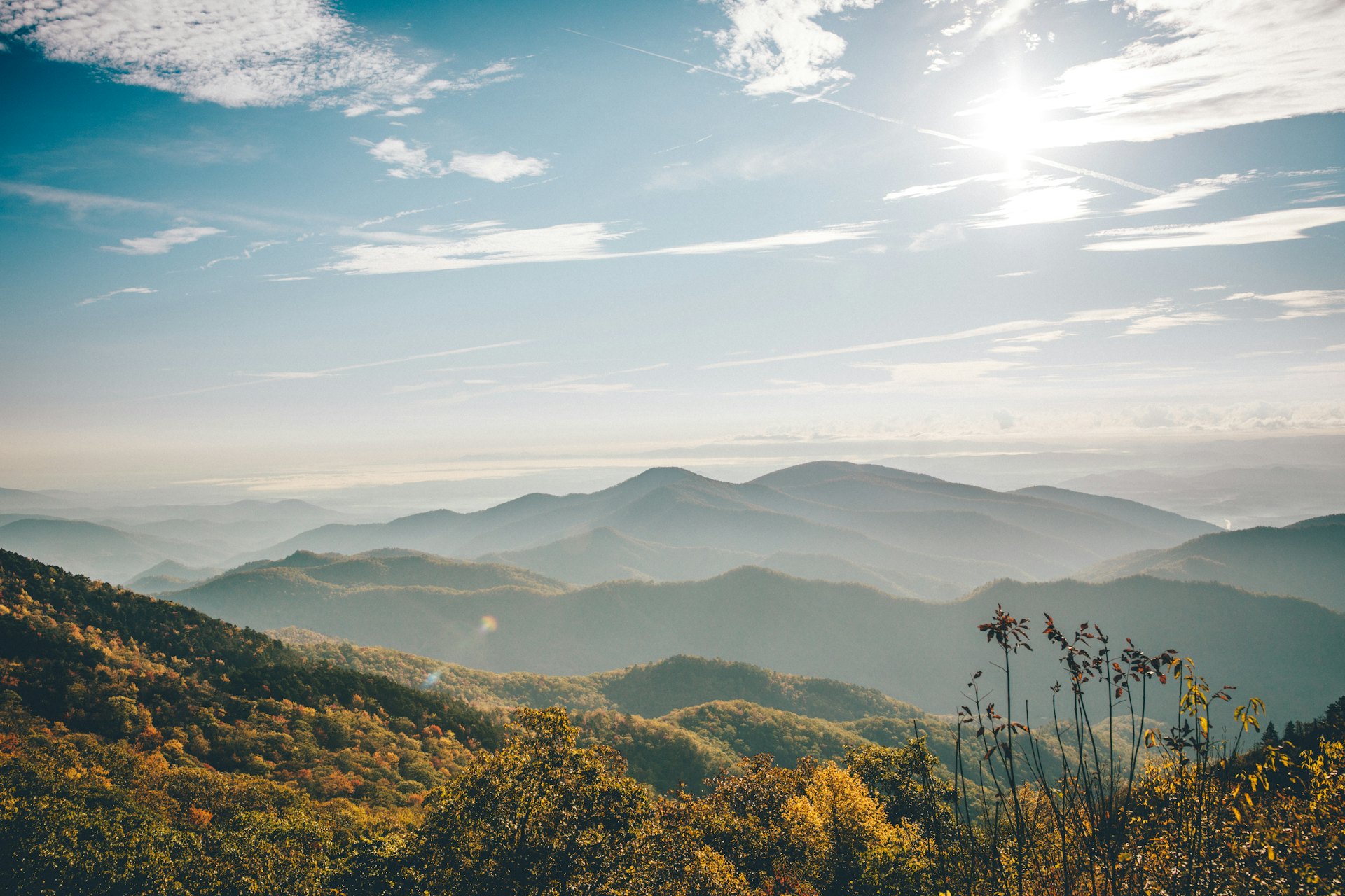 Hazy blue ridges of the Smoky Mountains under a bright sky